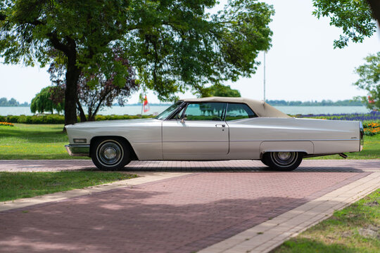 Side view of beautiful luxury full-size classic american automobile -  Cadillac De Ville Convertible 1968 (third generation 1965&ndash;1970), closed roof. Palic, Serbia, 30.06.2024