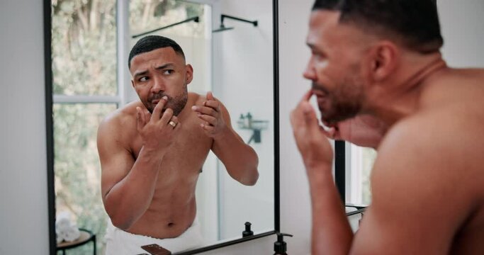 Mirror, skincare and man pop pimple in bathroom for facial grooming, cleaning or hygiene at home. Beauty, cosmetic and male person checking blackhead, breakout or acne by reflection in apartment.