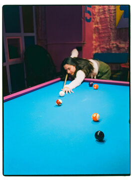 woman playing pool table snooker game
