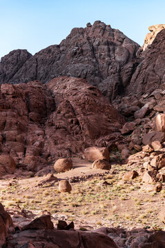 Rocky desert landscape with rugged terrain and boulders