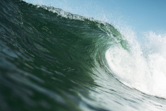 Wave curling with spray in ocean