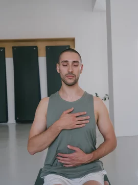 Portrait of Young Man Doing Heart Meditation