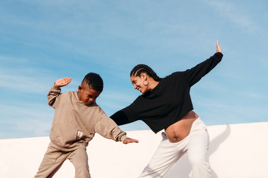 Mother and son working out outdoors