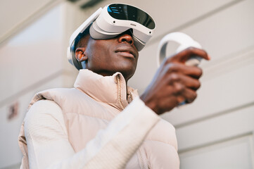 Man wearing virtual reality headset in urban setting