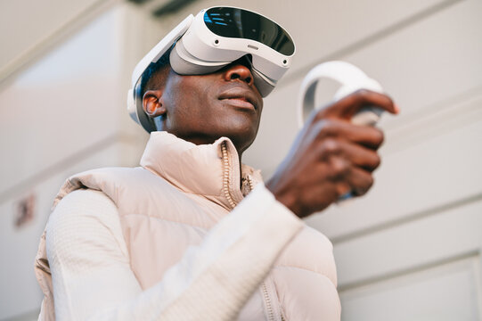 Man wearing virtual reality headset in urban setting