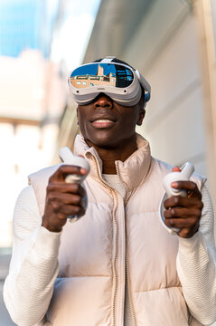 Man wearing virtual reality headset in urban setting