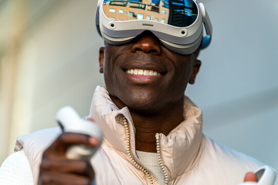 Man wearing virtual reality headset and smiling
