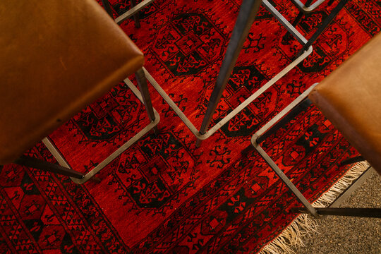 Chairs On Red Persian Carpet