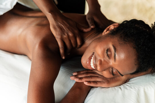 African woman enjoying a relaxing back massage