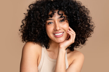 Radiant smile - curly haired woman portrait
