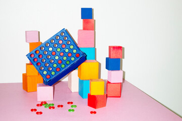 Connect four game and geometry building blocks with hard flashlight
