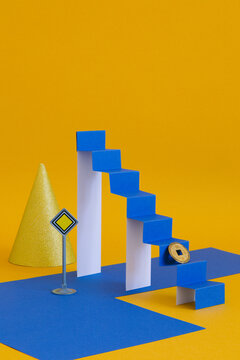 A minimalistic still life with a paper ladder