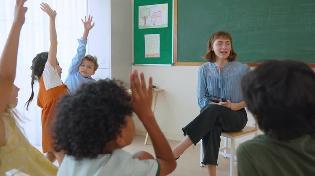 Caucasian young woman teacher teaching student in classroom at school.