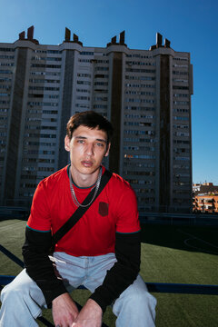 Young urban sports fan posing on a soccer field