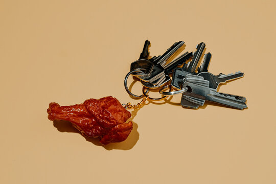 key chain in the shape of a fried chicken wing with some keys