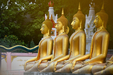Standing Buddha statue. Buddhist sculpture. Statues of Buddha.