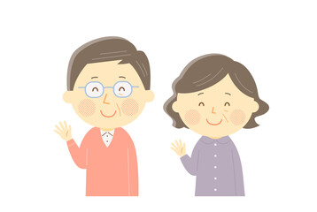 笑顔で手を振るシニア夫婦