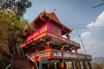 Fototapeta premium The Chinese shrine on the mountain at Wat Ban Tham, Kanchanaburi, Thailand
