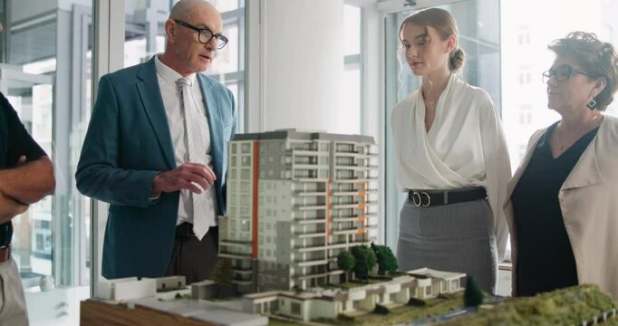 Presentation, man with model and architecture for building, strategy or discussion in office. Male engineer, display or team in workplace for construction, corporate real estate opportunity or design