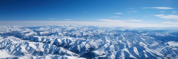 Obraz premium Aerial View of Snow-Covered Mountains