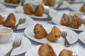 Fried spring rolls with sweet chili sauce for coffee break at a seminar at hotel