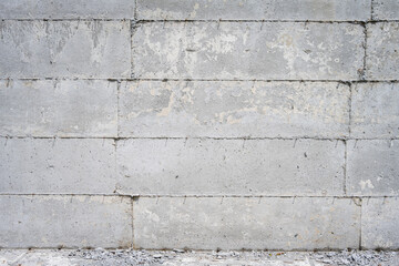 Closeup view of poured concrete foundation detail, as a construction background
