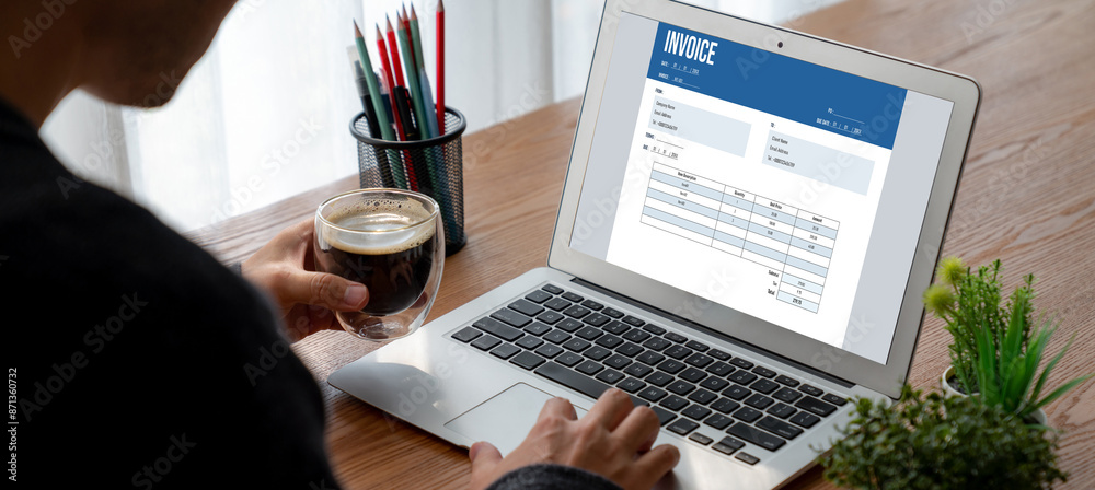 Poster invoice on computer screen from accounting application. computer program for financial and budget of