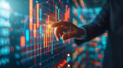 A businessman's hand interacts with a digital screen displaying data and graphs, symbolizing financial technology and data analysis.