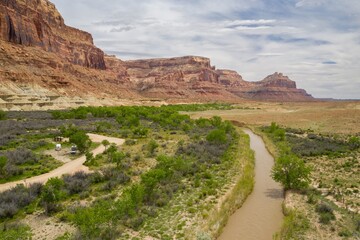 San Rafael River, grassland and tall Buttes, Buckhorn Wash, Utah, United States of America.