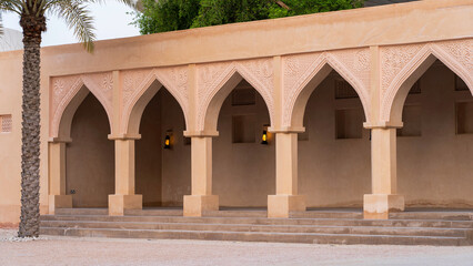 traditional qatari house exterior at the national qatar museum.