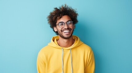 Fototapeta premium Portrait of a Cheerful Man in Yellow Hoodie