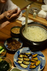 A lot of different dishes arrayed on the dinner table in japan.