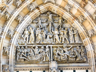 Decorative religious bas relief on the facade of the St Vitus Cathedral in Prague in Czech Republic