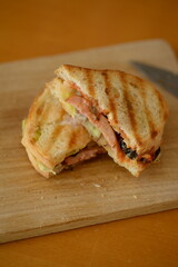 A ham panino sandwich for snack.
