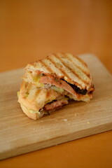 A ham panino sandwich for snack.
