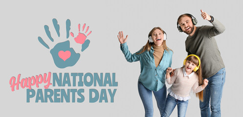 Happy family with headphones on light background