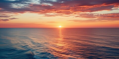 Obraz premium Stunning Sunset Over the Ocean, A stunning sunset over the vast ocean, A breathtaking sunset over the vast ocean
