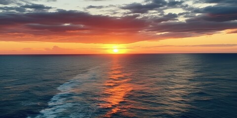 Fototapeta premium Sunset over the Ocean, A stunning sunset over the vast ocean, A breathtaking sunset over the vast ocean