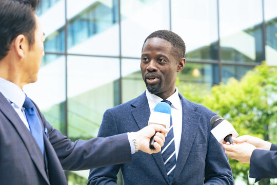 A black man being interviewed by the media