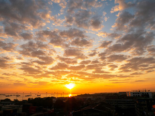 Scenic view dramatic beautiful sunset sky. Natural Sunset Sunrise on meadow silhouette shadow dark land. Vibrant dramatic sky on sunset, dawn, sunrise in Countryside. Landscape Colorful Sky At Sunset