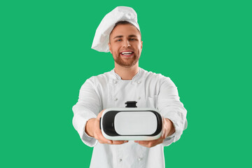Male chef with VR glasses on green background