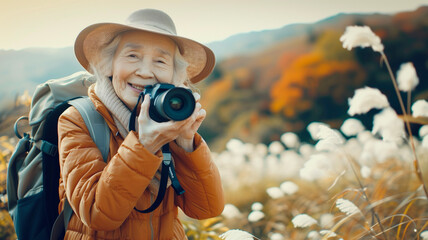 Front view of a senior woman capturing the beauty of nature