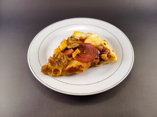 Cheesy and Meaty Pizza on Small White Plate Against Dark and Ash Abstract Background: Enjoy a Savory Delight with Melted Cheese and Flavorful Meat, Perfectly Presented for Your Culinary Pleasure