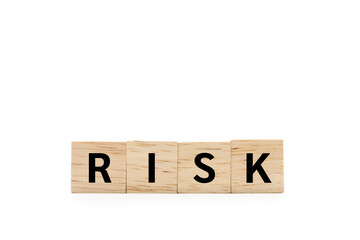 RISK wooden blocks of business concept isolated on white background. Copy space and Clipping Path. Financial Crisis, Economic, Business risk management.