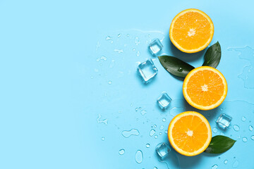 Composition with tasty oranges, leaves and ice cubes on blue background