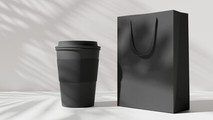a black paper bag and a black coffee cup