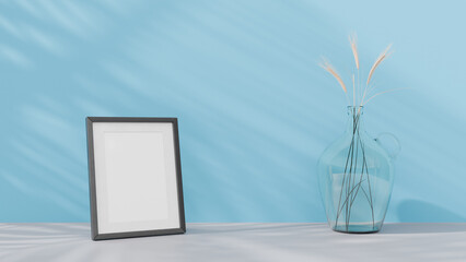 Obraz premium a picture frame and a vase with some flowers