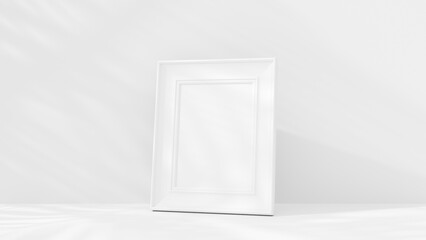 a white frame sitting on a white surface