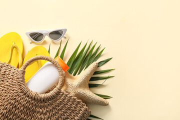 Beautiful composition with beach accessories on beige background
