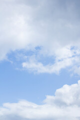Blue sky and white puffy clouds.
